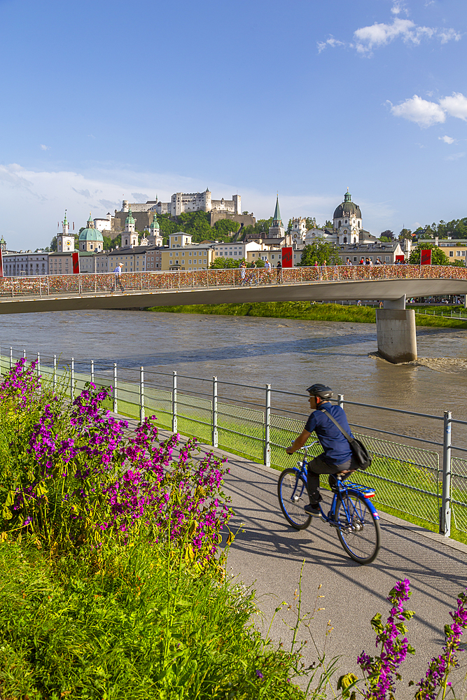 View of Hohensalzburg Castle and footbridge over Salzach River, UNESCO World Heritage Site, Salzburg, Austria, Europe