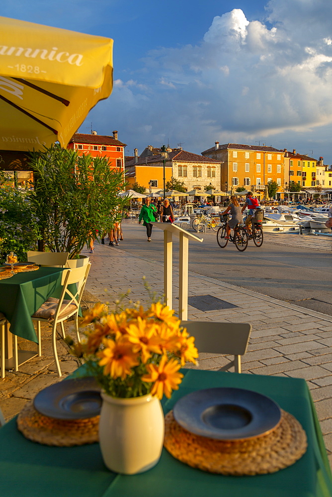 View of restaurant table set and Old Town buildings, Rovinj, Istria, Croatia, Adriatic, Europe