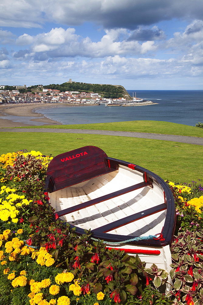 Rowing boat and flower display at South Cliff Gardens, Scarborough, North Yorkshire, Yorkshire, England, United Kingdom, Europe