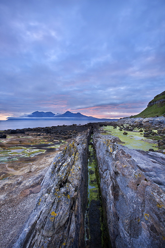 Dusk on the Isle of Eigg with Rum in the distance, Inner Hebrides, Scotland, United Kingdom, Europe