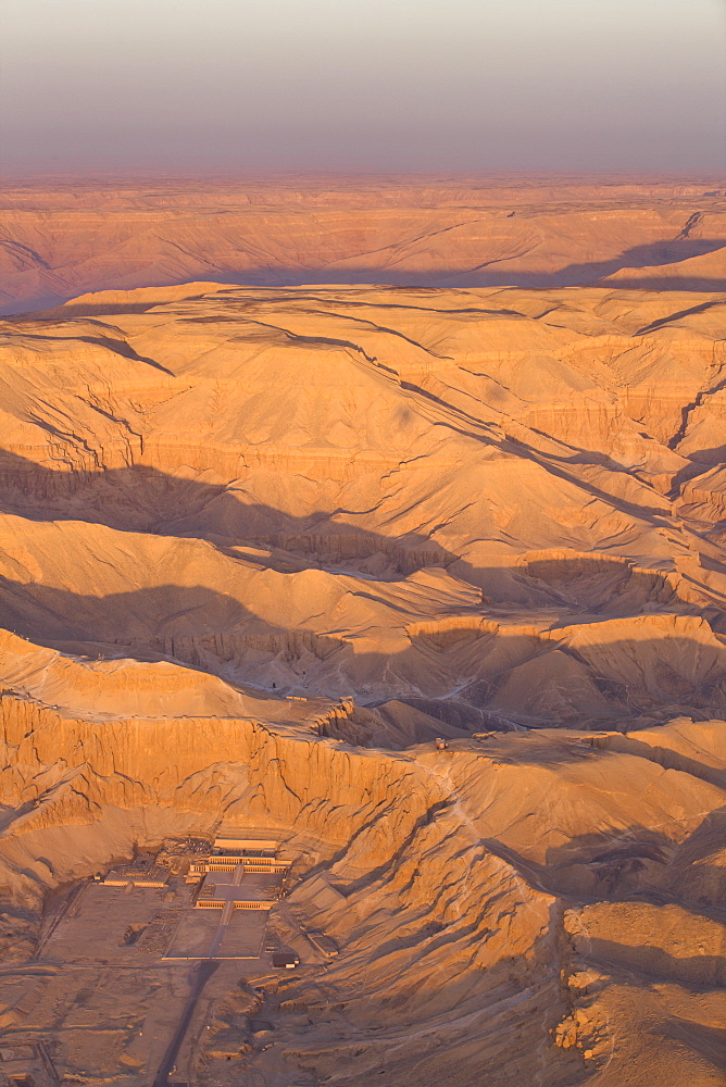 Aerial view from hot air balloon of Hatshepsut's Mortuary Temple at Deir el-Bahri, and the Valley of the Kings at sunrise, Thebes, UNESCO World Heritage Site, Egypt, North Africa, Africa