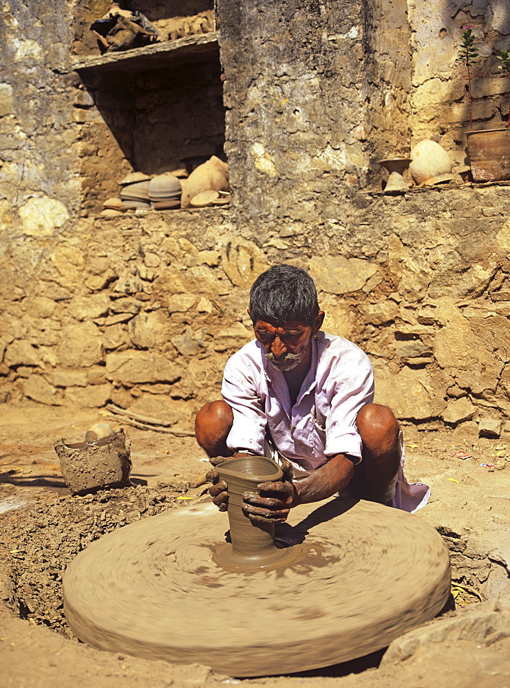 The village potter at work making water pots in Nimaj, Rajasthan, India, Asia