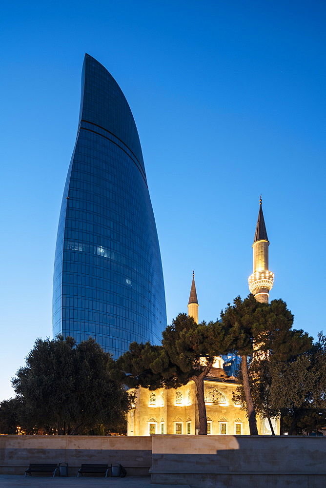 Exterior of The Shahid Mosque with Flame Towers in background at night, Baku, Azerbaijan, Central Asia, Asia