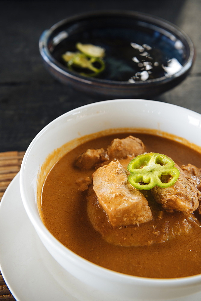 Bowl of traditional Ghanaian dish of fish soup and homemade Fufu, Busua, Ghana, Africa