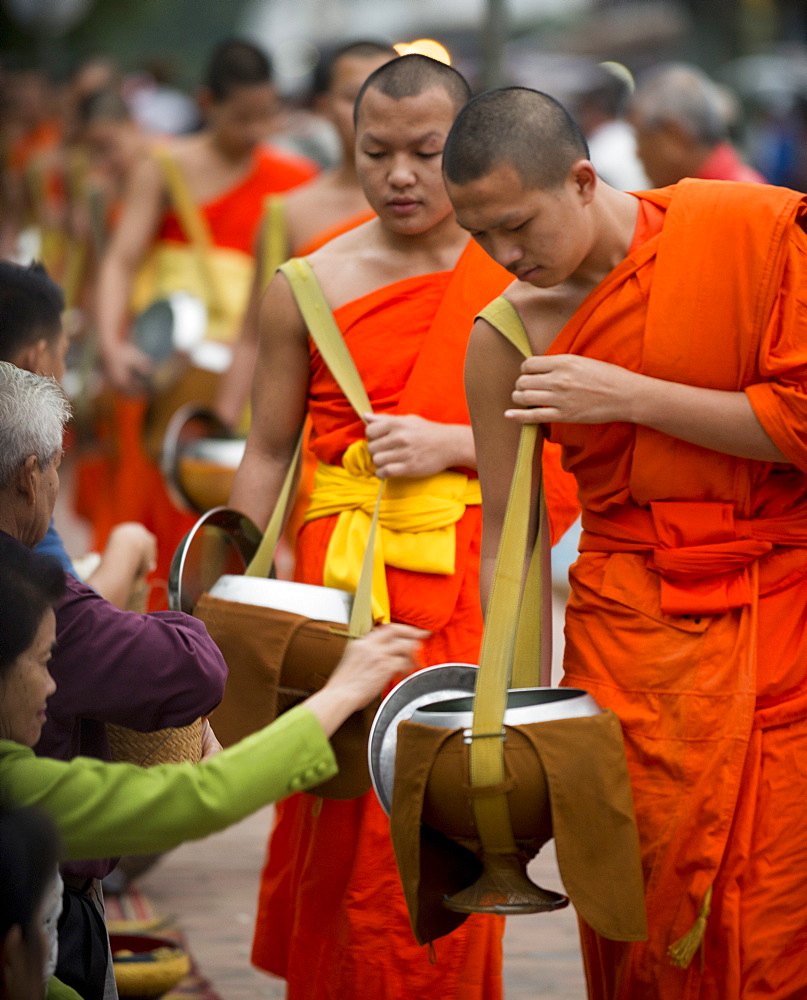 Buddhist Monks during Alms giving ceremony (Tak Bat), Luang Prabang, Laos, Indochina, Southeast Asia, Asia