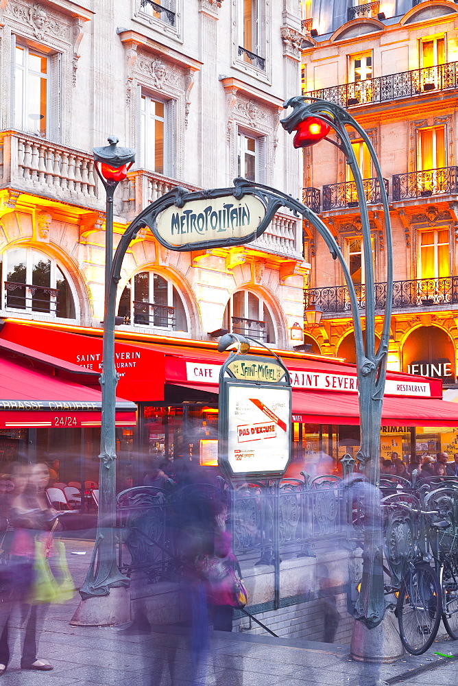 Crowds of people rushing through the entrance to a metro station in Paris, France, Europe