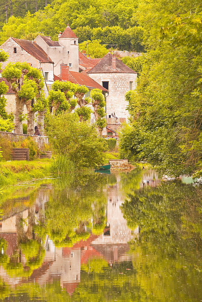 Old houses of the village of Noyers sur Serein reflecting in the River Serein, Yonne, Burgundy, France, Europe