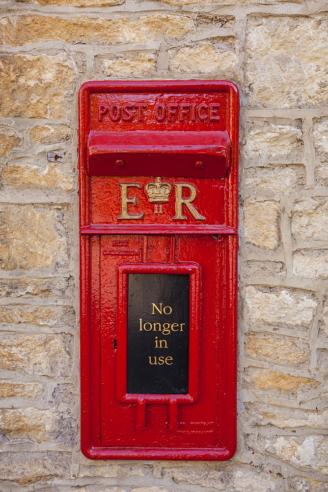 An old postbox that is no longer in use at Castle Combe in Wiltshire, England, United Kingdom, Europe