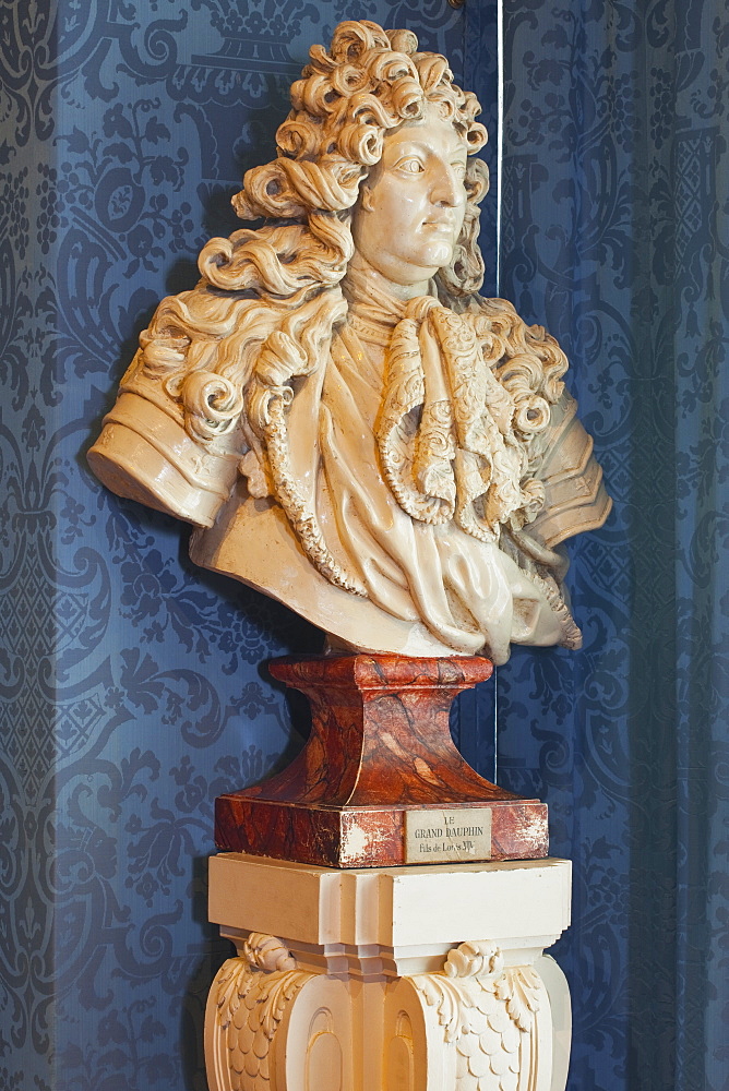 A bust of the Grand Dauphin (Louis de France) watches out of a window in the Chateau de Chambord, UNESCO World Heritage Site, Loir-et-Cher, Centre, France, Europe