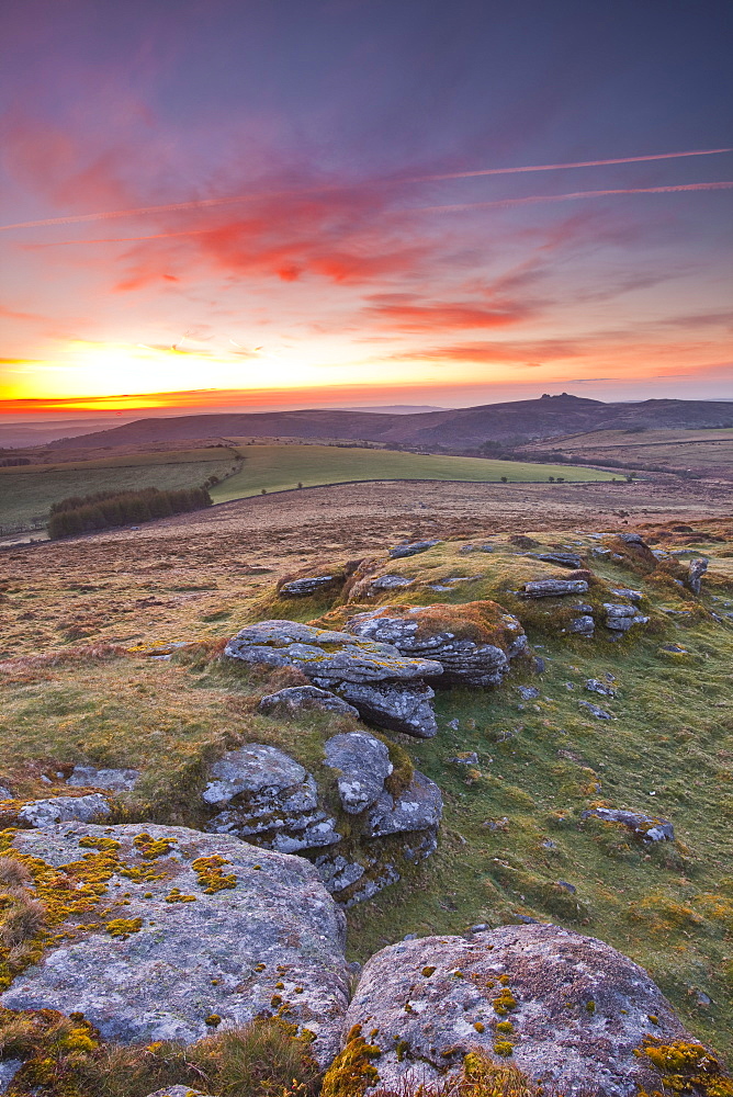 A colourful dawn on Chinkwell Tor in Dartmoor National Park, Devon, England, United Kingdom, Europe