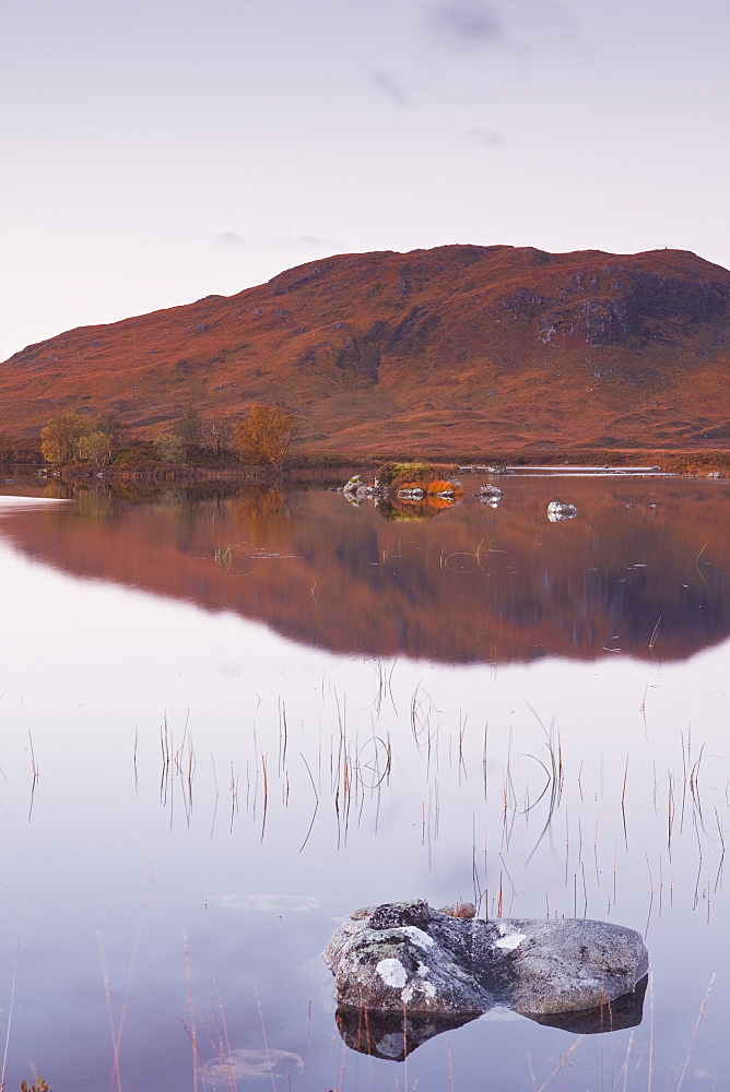 Lochan na h-Achlaise reflecting the surrounding mountains on Rannoch Moor, a Site of Special Scientific Interest, Scotland, United Kingdom, Europe