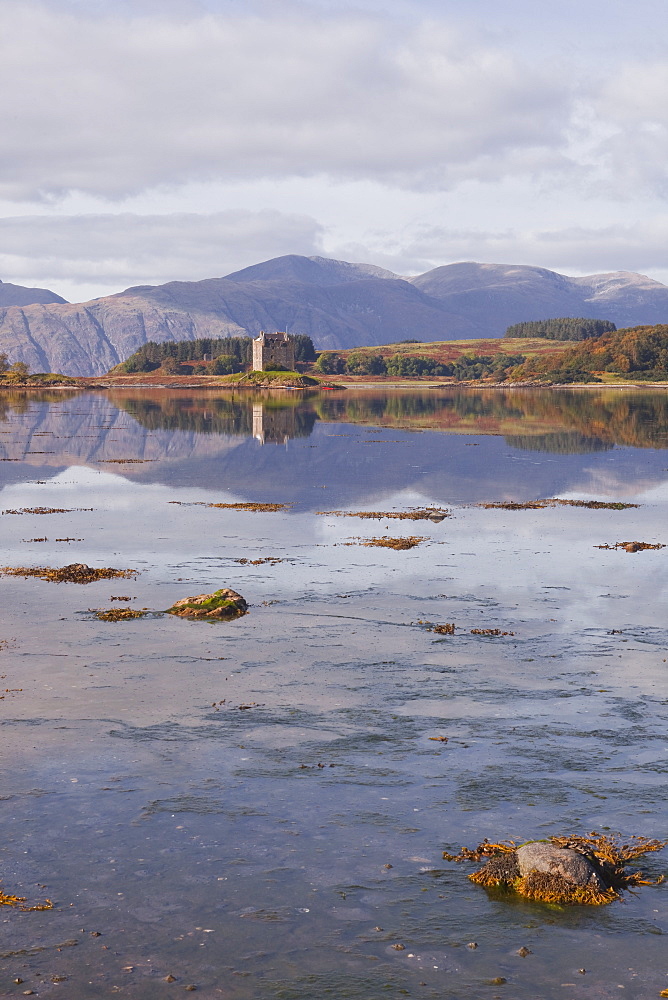 Castle Stalker reflecting into the waters of Loch Laich, Argyll and Bute, Scotland, United Kingdom, Europe 