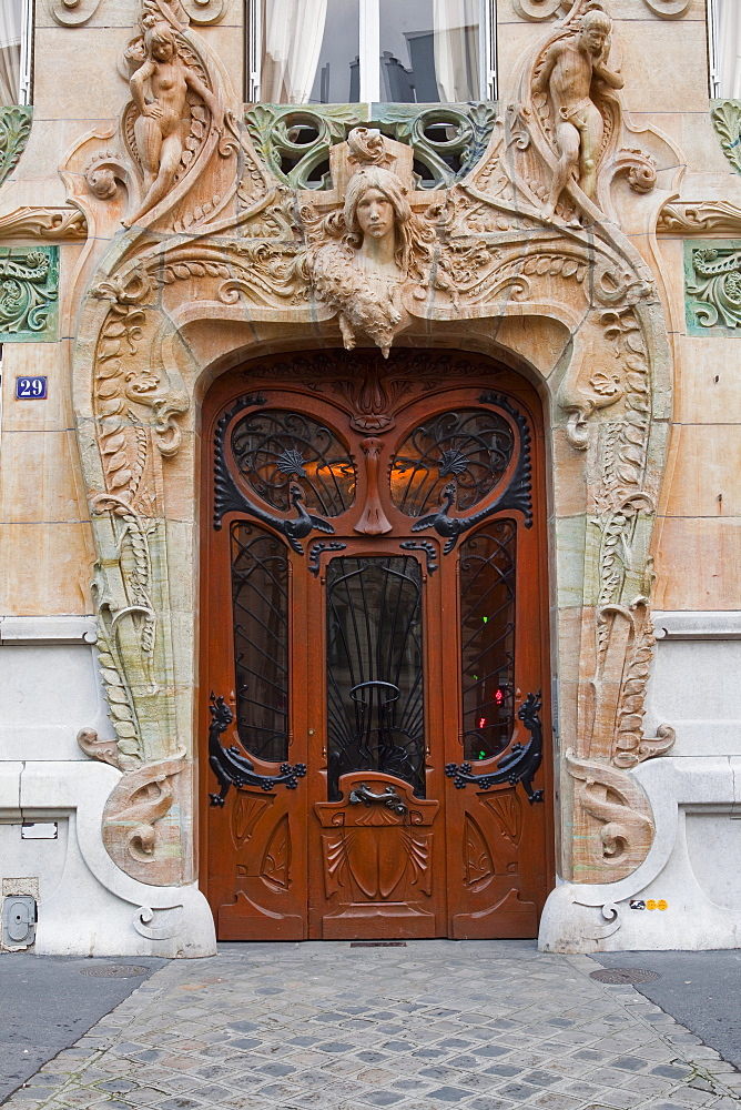 An art nouveau doorway in central Paris, France, Europe