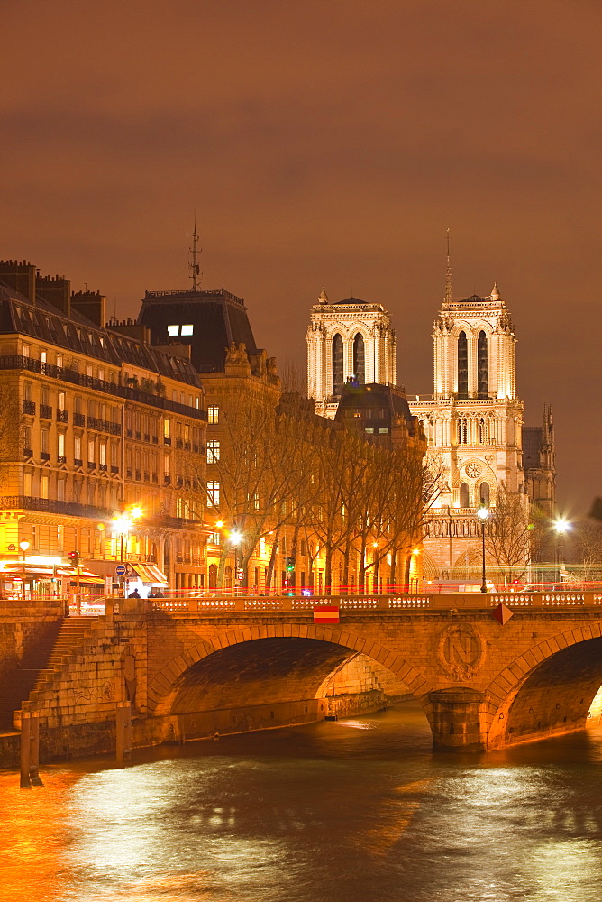 The Ile de la Cite and Notre Dame cathedral at night, Paris, France, Europe