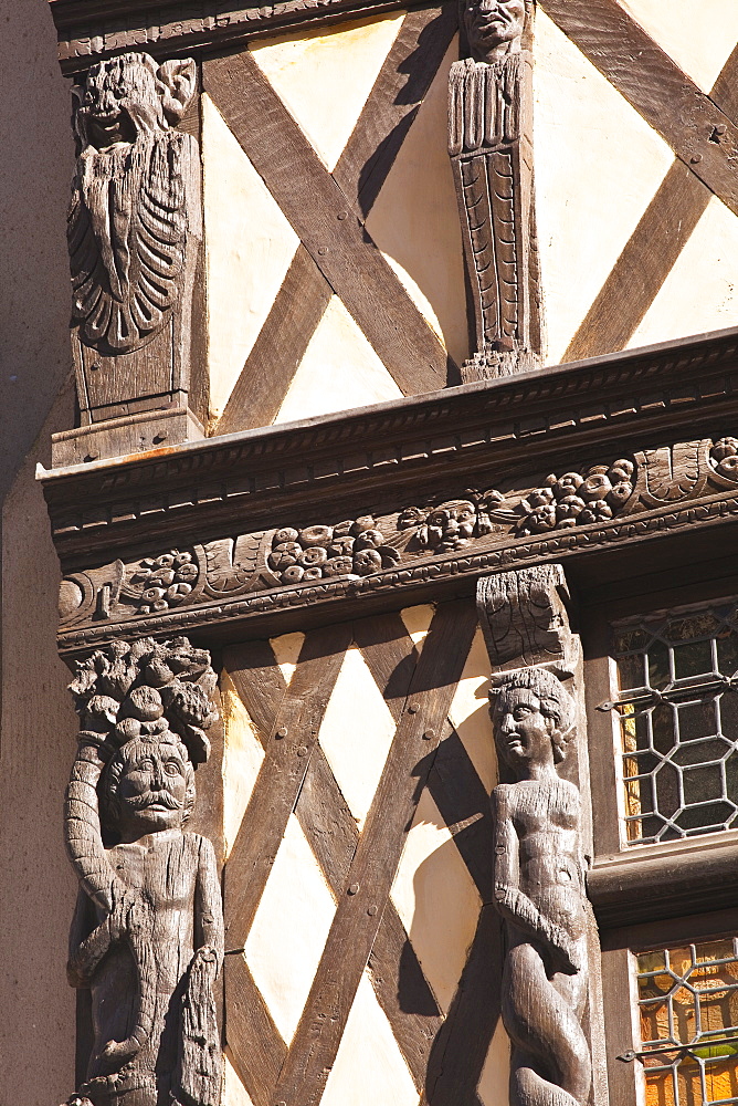 Wooden sculptures adorn a half-timbered house in Angers, Maine-et-Loire, France, Europe