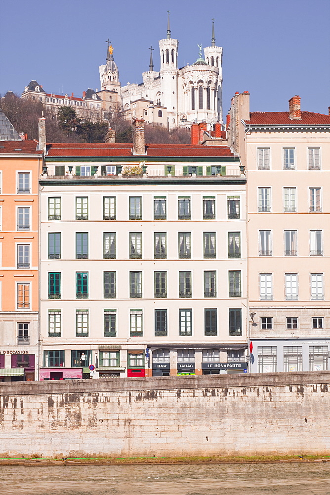 The waterfront in Old Lyon with the Basilica Notre Dame de Fourviere on the hill, Lyon, Rhone-Alpes, France, Europe 