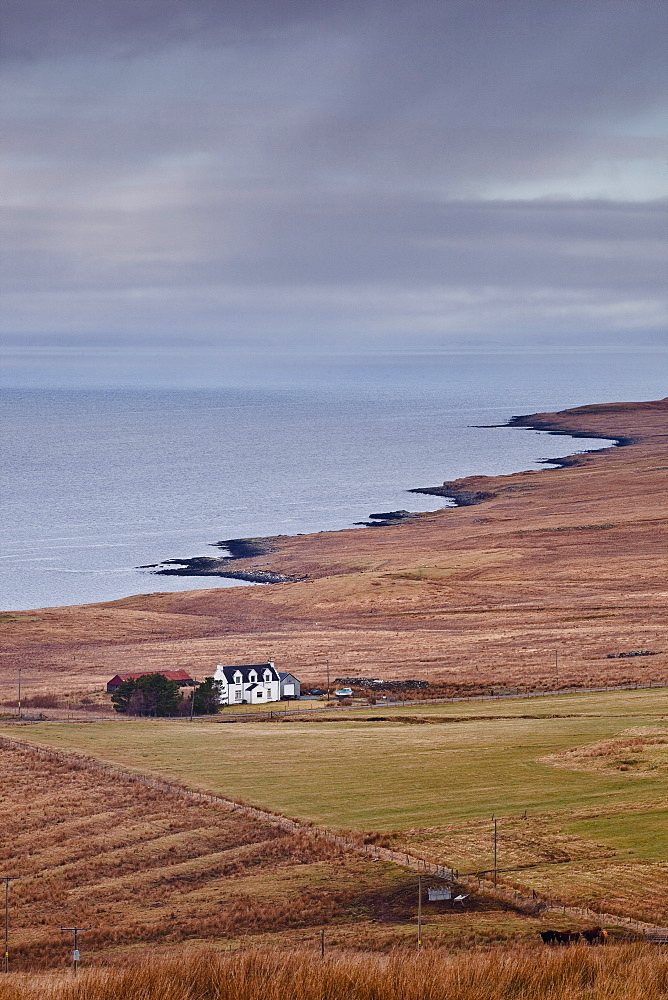 A solitary house sits on the north west coast of the Isle of Skye, Inner Hebrides, Scotland, United Kingdom, Europe 