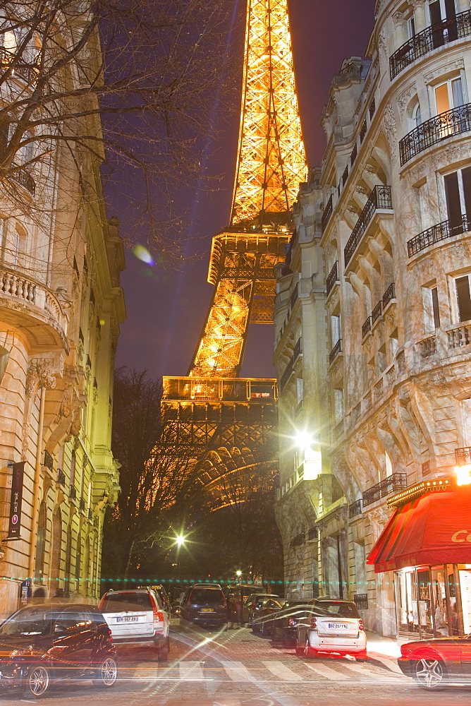 The iconic Eiffel Tower lit up at dusk in central Paris, France, Europe