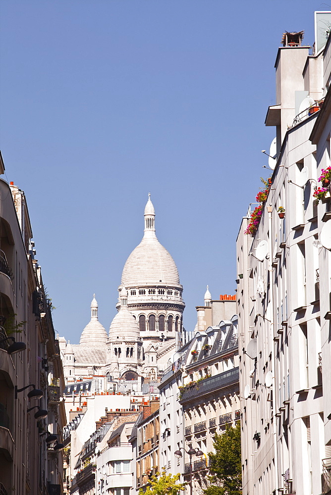 The Basilica of Sacre Coeur through the streets of Montmartre, Paris, France, Europe