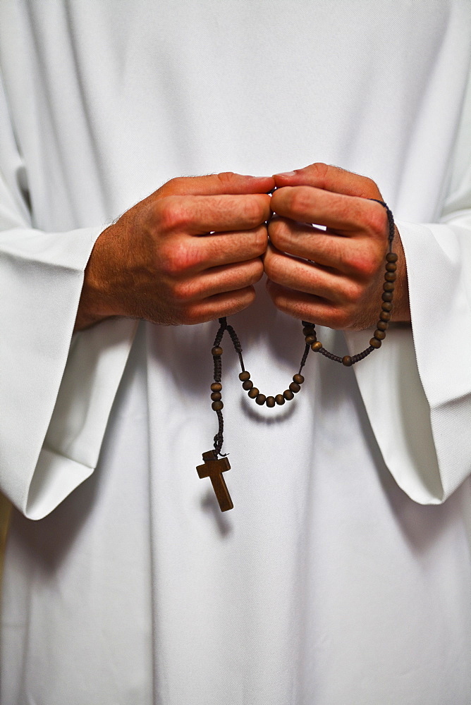 A priest holds his rosemary beads, Lyon, Rhone, France, Europe 