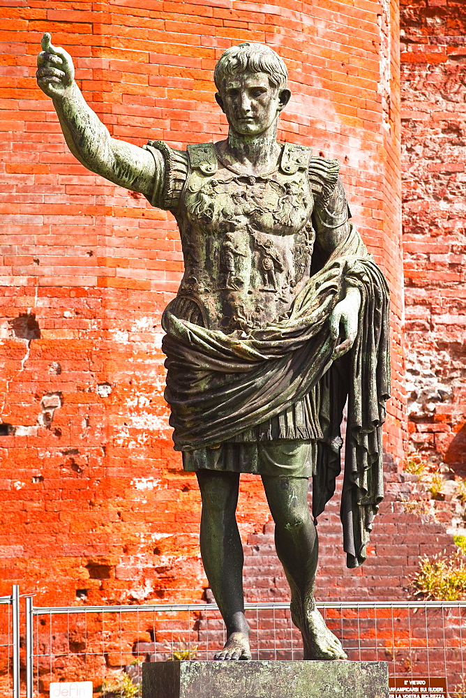 A statue of Caesar Augustus in front of Porta Palatina, Turin, Piedmont, Italy, Europe