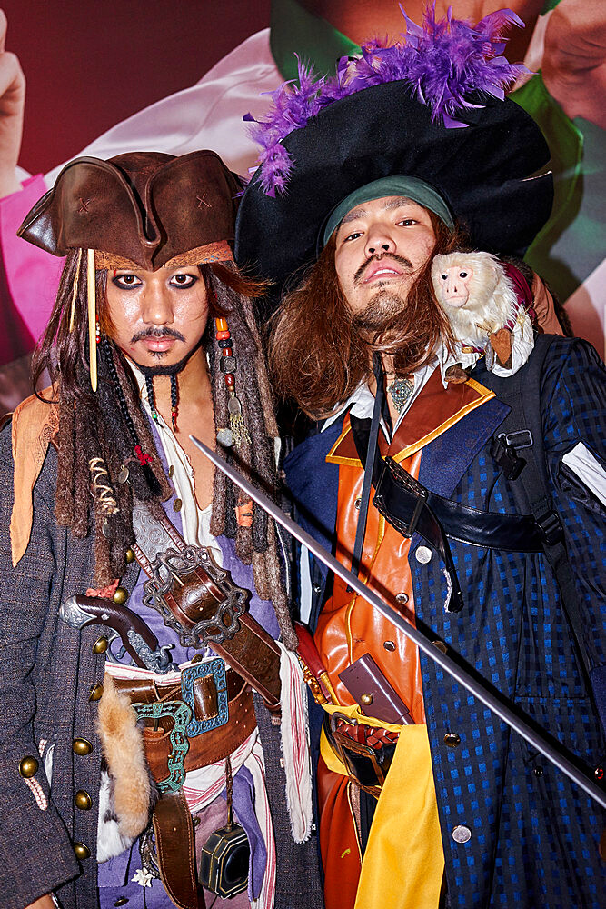 Japanese men dressed as Captain Jack Sparrow and Captain Barbossa from the Pirates of the Caribbean on Halloween in Shibuya, Tokyo, Japan, Asia