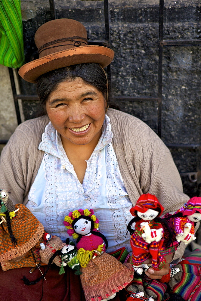 Indigenous lady selling dolls, Arequipa, Peru, South America