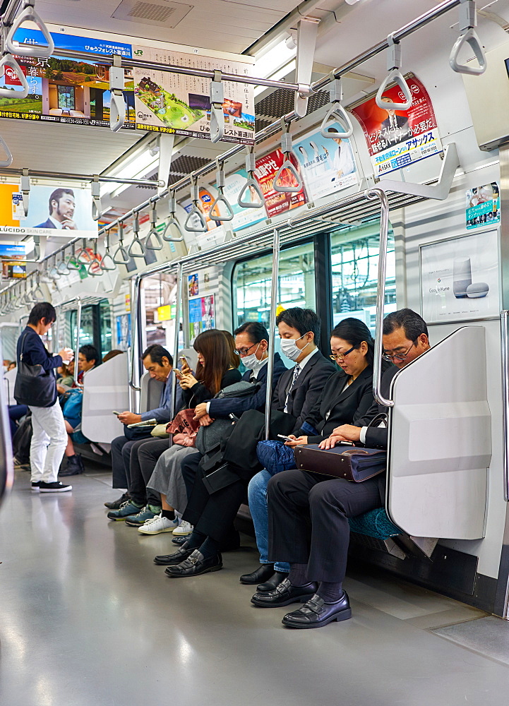 Passengers on a Tokyo subway train, Tokyo, Japan, Asia