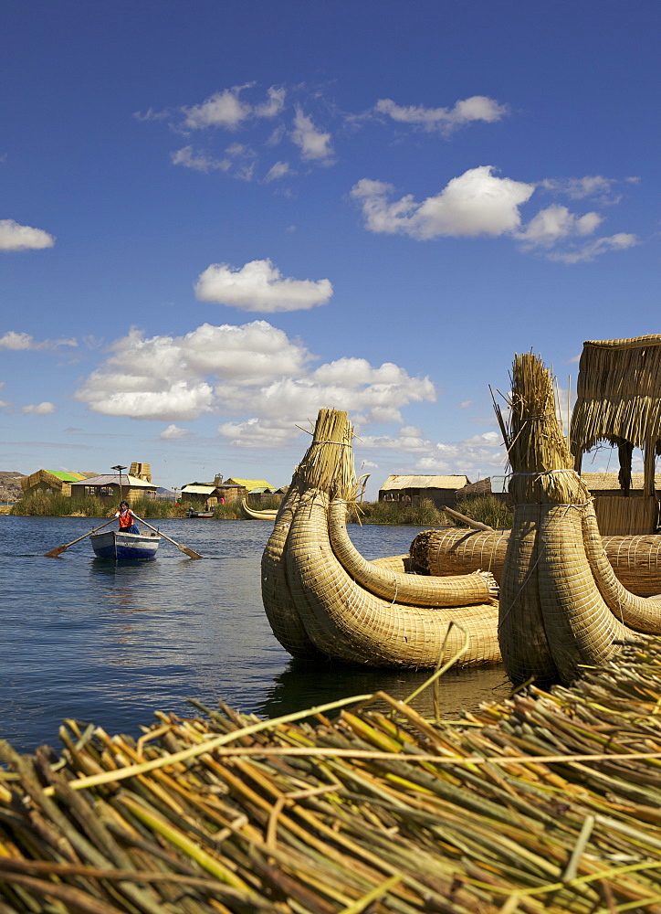 Aymara girl in a rowboat, Uros Island, Lake Titicaca, peru, peruvian, south america, south american, latin america, latin american South America