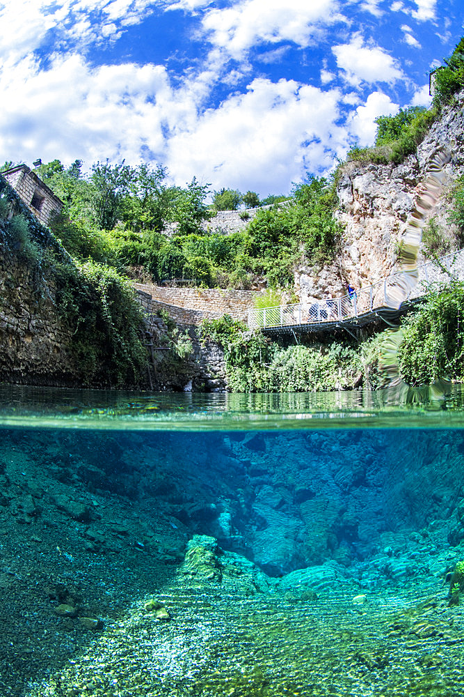 Mid-air-mid-water view of the Burles spring, karstic exsurgence of Vauclusian type, on the commune of sainte-Enimie, Lozere, Occitania, France.