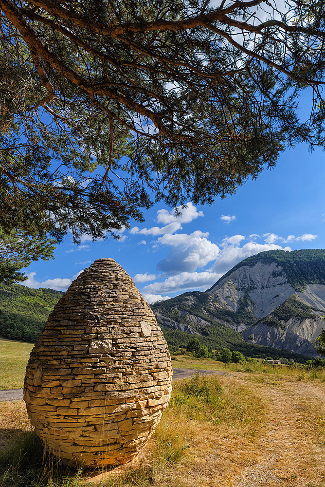 Sentinel, Andy Goldsworthy, 1999, Col du Defens, Alpes de haute Provence, France "The work Sentinels, which is part of the Refuge d'art project, is a journey through the Dignois region, at the foot of the Southern Alps. Such a project associates art, nature and the territory. The three Sentinels are stone cairns, one for each of the three valleys of the Haute-Provence Geological Reserve.