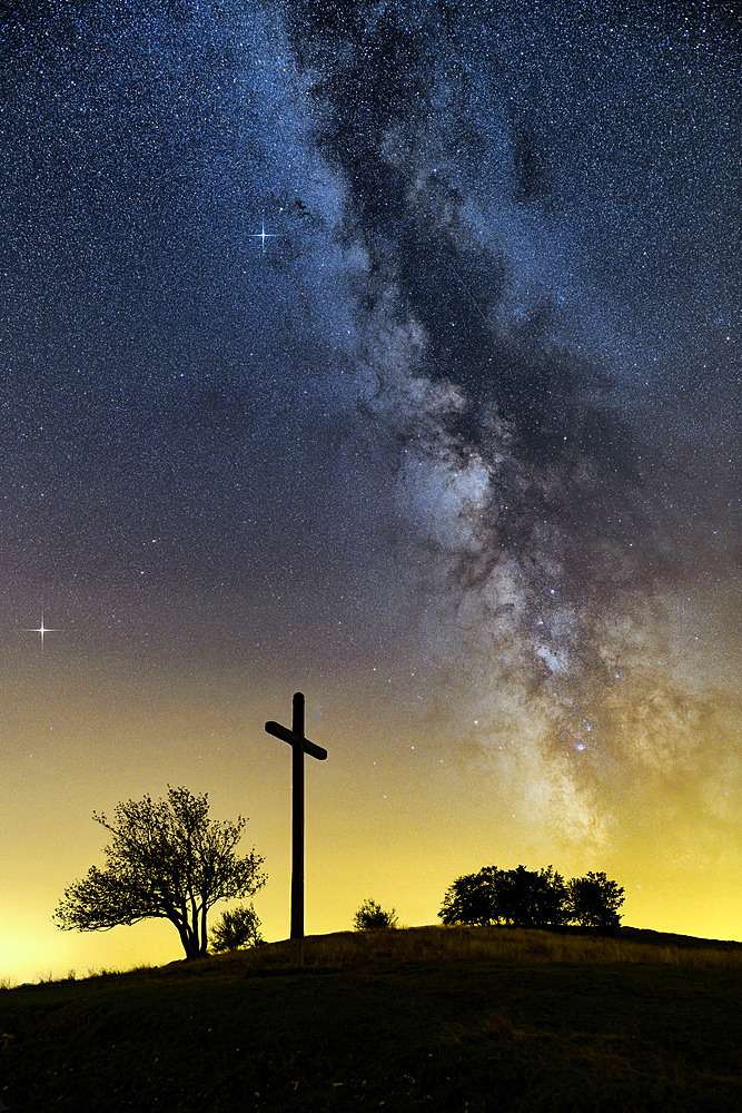 The Milky Way over the Jura in summer, Jupiter and Saturn shining near the Milky Way, Croix de Famban, in the Grand Colombier massif, Ain, France