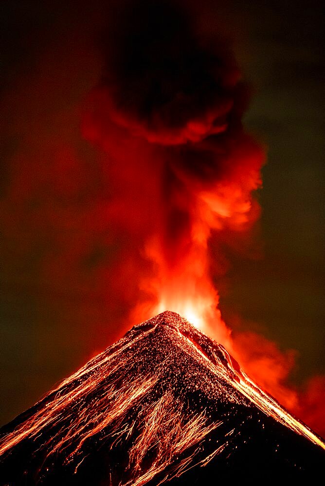 Volcán de Fuego (Volcano of fire) eruption at night, Sierra Madre de Chiapas, Guatemala.