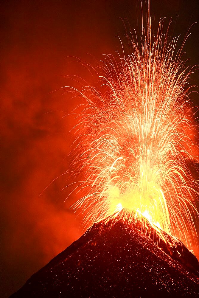 Volcán de Fuego (Volcano of fire) eruption at night, Sierra Madre de Chiapas, Guatemala.