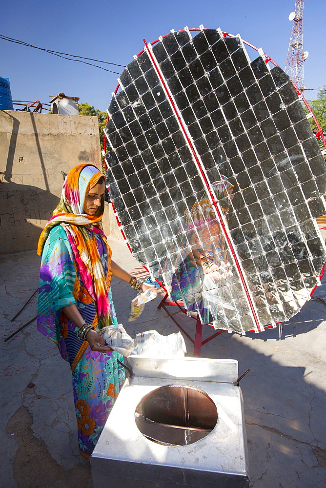 Women constructing solar cookers at the Barefoot College in Tilonia, Rajasthan, India. The Barefoot College is a worldwide charity, founded by Bunker Roy, its aims are, education, drinking water, electrification through solar power, skill development, health, women empowerment and the upliftment of rural people.