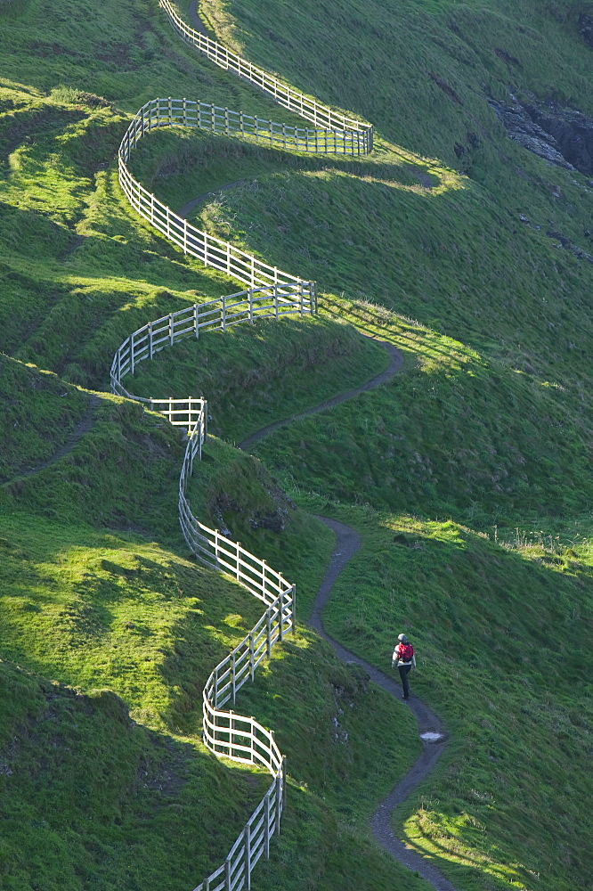 A winding fence and the South West Coast Path near Port Isaac in Cornwall, England, United Kingdom, Europe