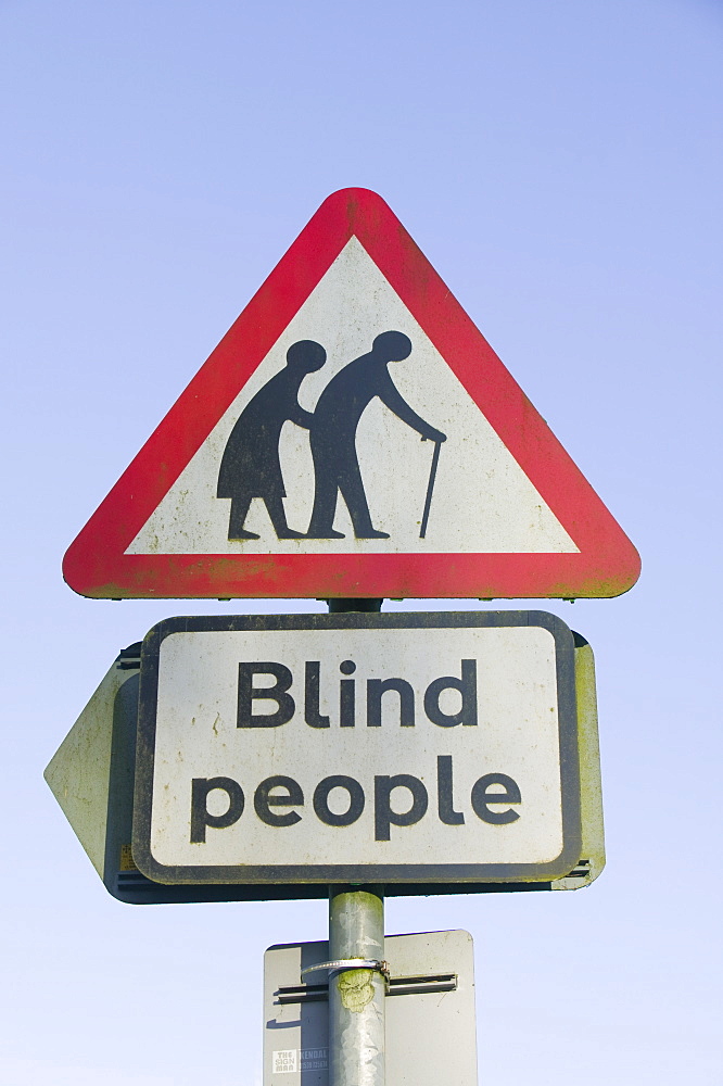 A warning for blind people crossing the road, Windermere, Cumbria, England, United Kingdom, Europe