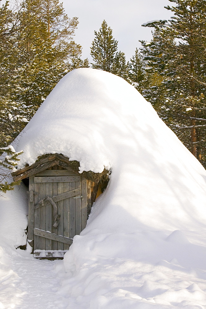 A traditional Sami house in winter in Saariselka, Northern Finland, Finland, Scandinavia, Europe