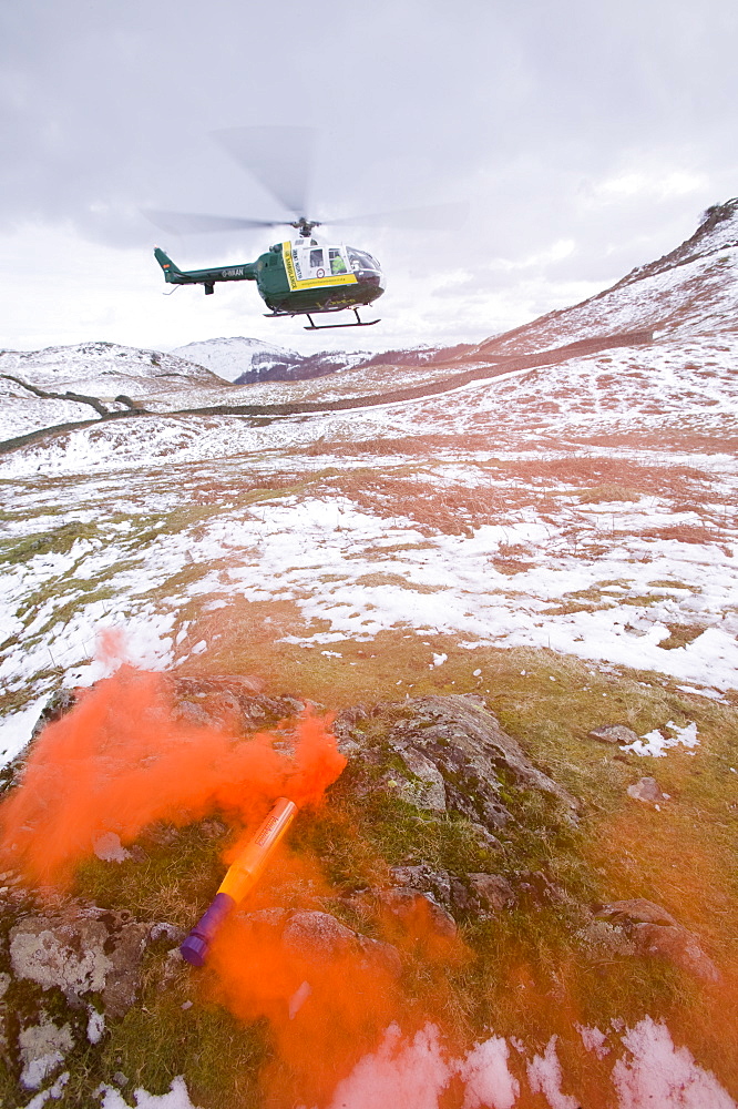 An air ambulance attending a mountain rescue incident near Grasmere, Lake District, Cumbria, England, United Kingdom, Europe