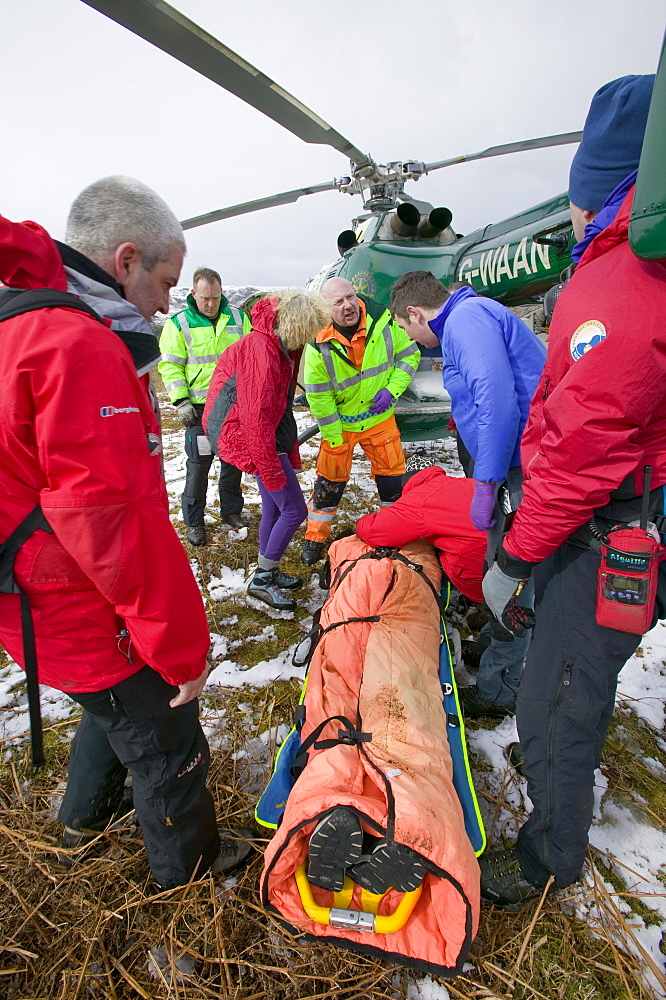 An air ambulance attending a mountain rescue incident near Grasmere, Lake District, Cumbria, England, United Kingdom, Europe