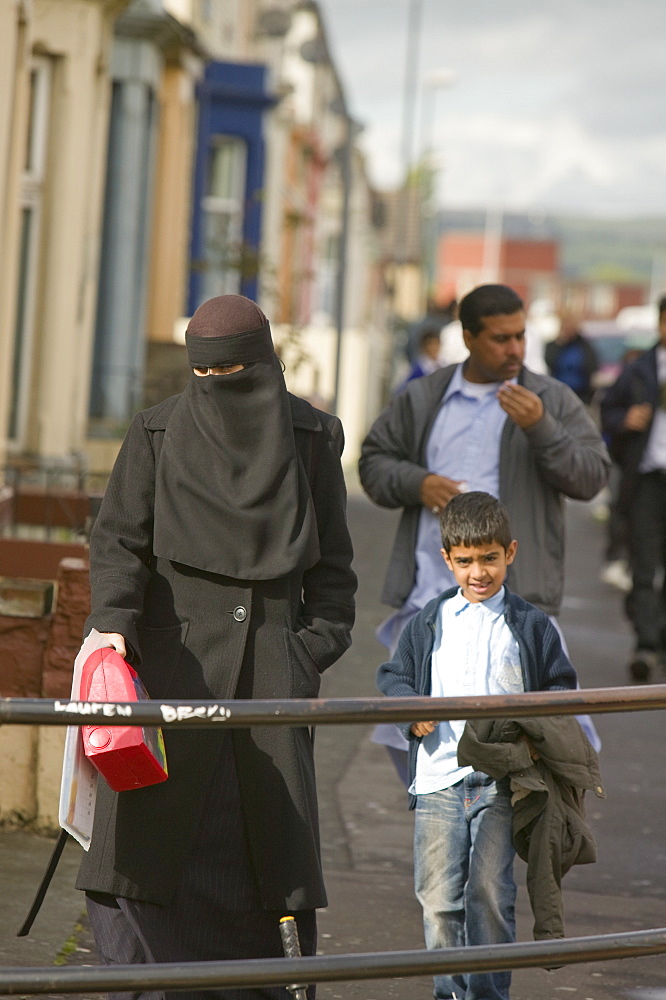 A Pakistani women wearing a burkha on the streets in an Asian area of Burnley, Lancashire, England, United Kingdom, Europe