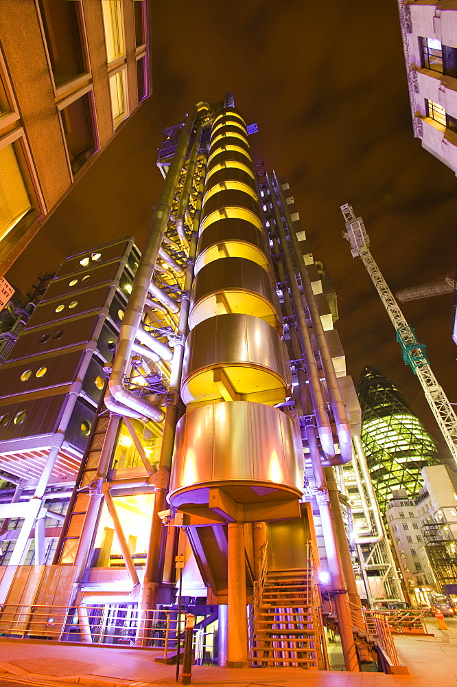 Lloyds Insurance building and the Swiss Re Tower at night in London, England, United Kingdom, Europe