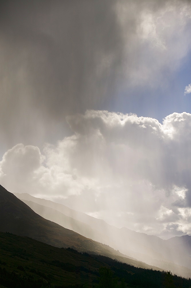 A shower over Turnagain Pass in the Chugach Mountains in Alaska, United States of America, North America