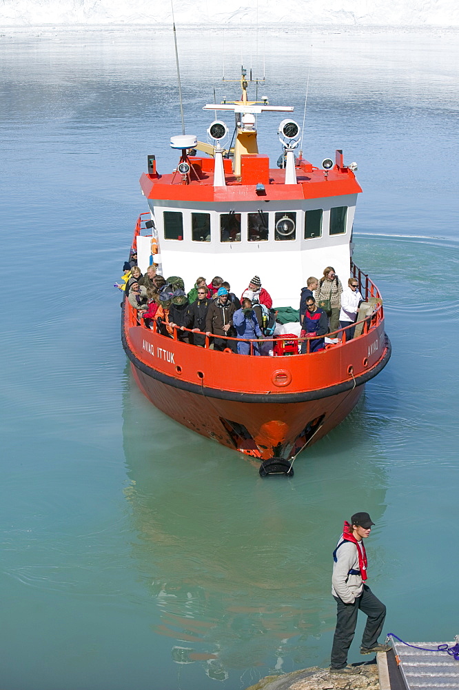 Passengers landing at Camp Victor by the Eqip Sermia glacier that is receding rapidly due to global warming on the west coast of Greenland, Polar Regions