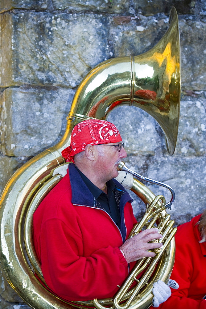 A musician playing a wind instrument