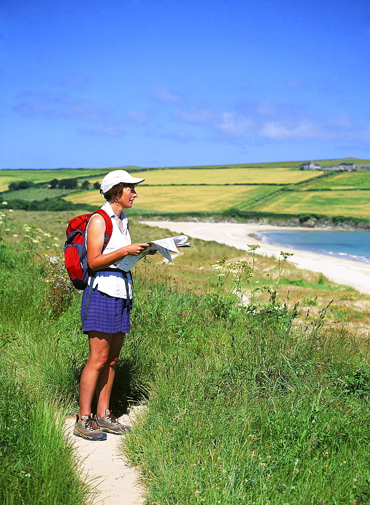 A woman on the South West Coast Path near Padstow in Cornwall, England, United Kingdom, Europe