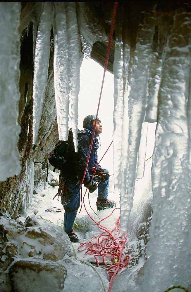 A mountaineer ice climbing on Low Water Beck near Coniston, Lake District National Park, Cumbria, England, United Kingdom, Europe