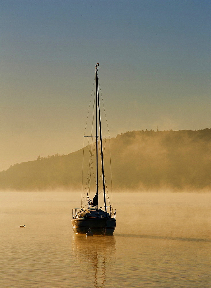 Morning mist over Lake Windermere in the Lake District National Park, Cumbria, England, United Kingdom, Europe