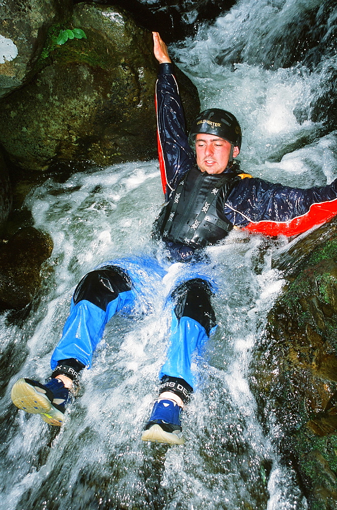 A man canyoning in mid Wales, United Kingdom, Europe