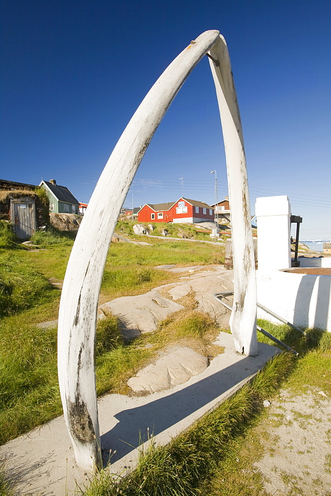 A whale bone arch and old vats for rendering down whale blubber in Ilulissat, Greenland, Polar Regions